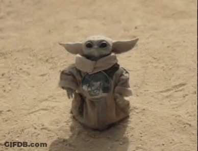 Baby Yoda Standing In Desert Holding Shield GIF