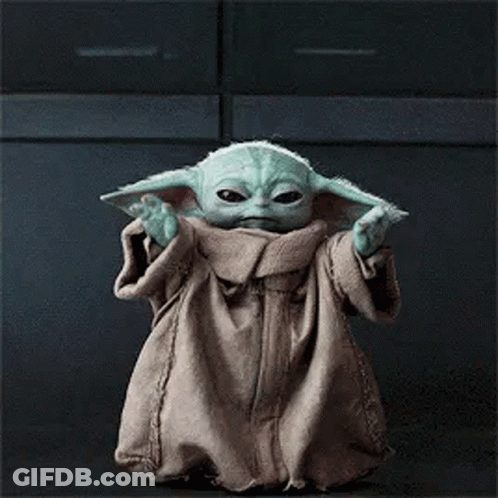 Baby Yoda Standing In Front Of Dark Background GIF