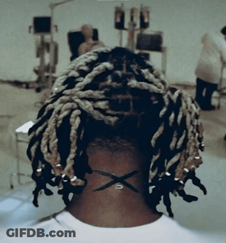 Back Of Head With Dreadlocks And X On Neck GIF