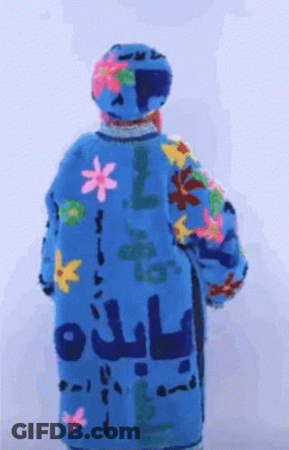 Back Of Person In Blue Coat With Flowers And Letters GIF