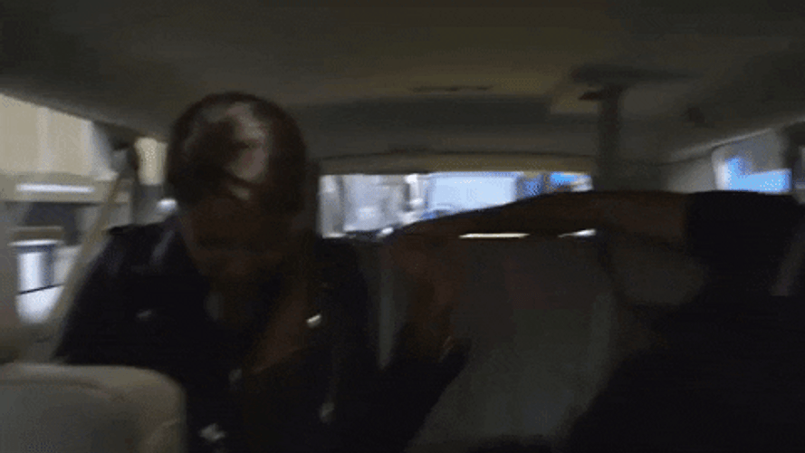 Backseat Woman Headbanging GIF