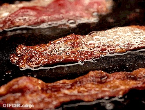Bacon Is Being Cooked In A Frying Pan GIF
