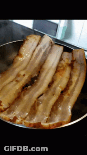 Bacon Slices Cooking In A Pan GIF