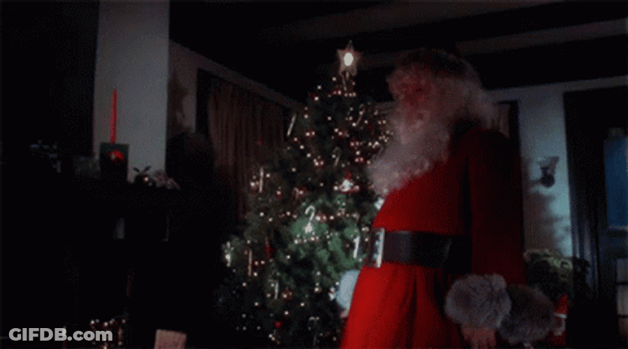 Bad Santa Holding A Knife GIF