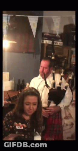 Bagpiper With Men In Hats And Kilts GIF