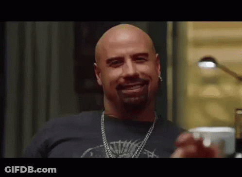 Bald Bearded Man In Black Shirt And Chain GIF