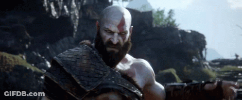Bald Bearded Man In Field With Mountains GIF