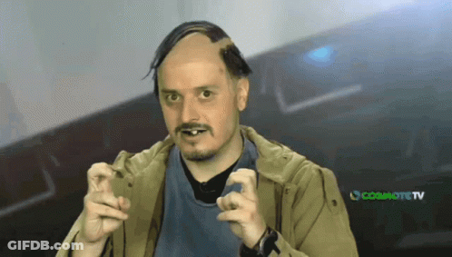 Bald Bearded Man In Front Of Cosmote TV GIF
