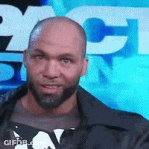 Bald Bearded Man In Front Of NBC Sign GIF