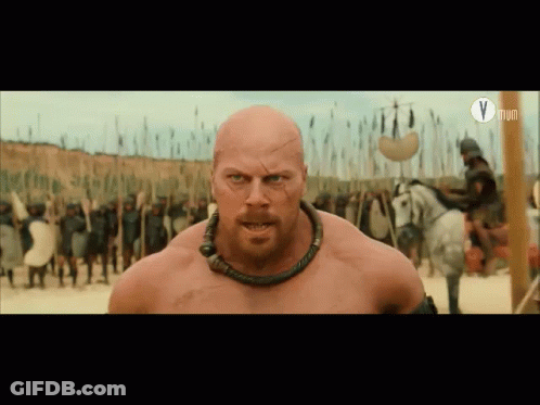 Bald Bearded Man In Front Of Soldiers With Letter V GIF