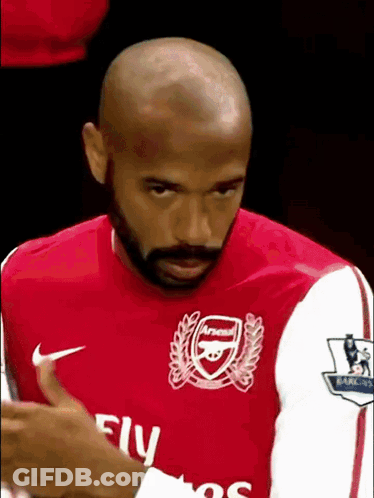 Bald Bearded Man In Red Fly Emirates Shirt GIF