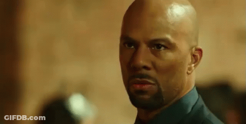 Bald Bearded Man Looking At Camera GIF