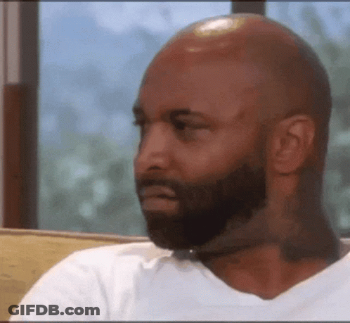 Bald Bearded Man Looking Sideways GIF