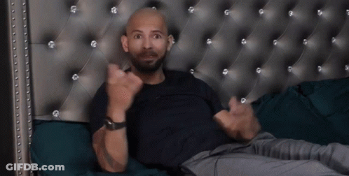 Bald Bearded Man Lying On Bed GIF