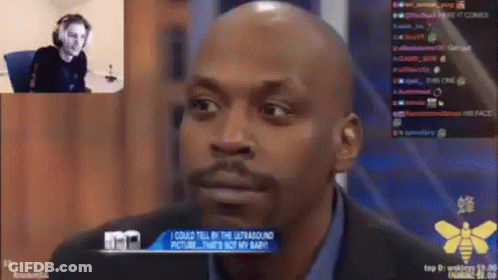 Bald Bearded Man Sitting In Front Of Screen GIF