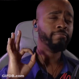 Bald Bearded Man With Ear Buds Making OK Sign GIF