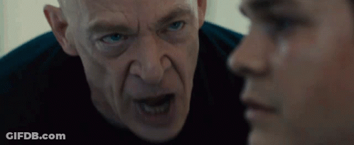 Bald Blue-Eyed Man Looking At Another Man GIF