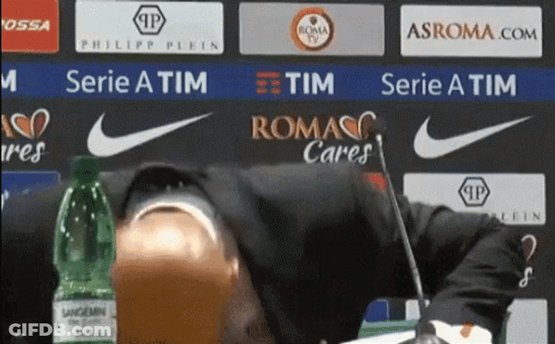 Bald Guy Banging Head On Desk GIF