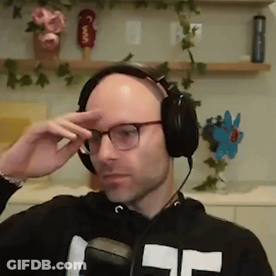 Bald Man Adjusting Headphones And Glasses GIF