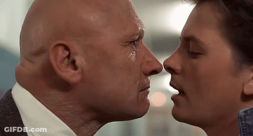 Bald Man And Younger Man Kissing GIF