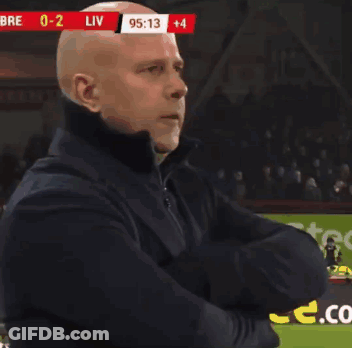 Bald Man Arms Crossed Soccer Field Scoreboard Liv GIF