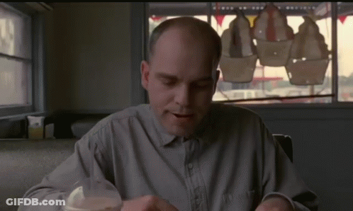Bald Man At Table GIF