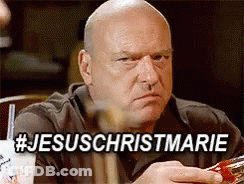 Bald Man At Table With Sign Saying Jesus Christmarie GIF