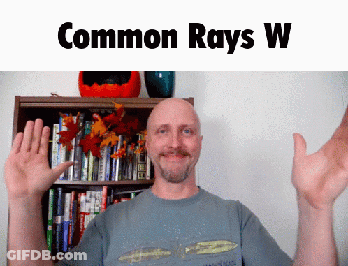 Bald Man By Bookshelf Saying Common Rays W GIF