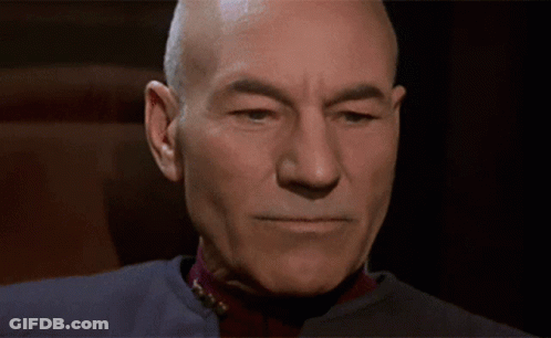 Bald Man Close Up Dark Background GIF