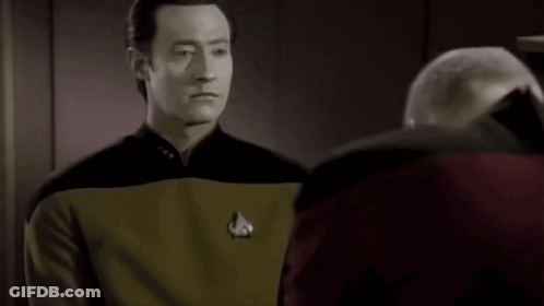Bald Man Close Up Looking At Camera GIF
