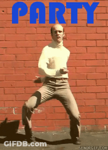 Bald Man Dancing In Front Of Red Brick Wall Saying Party GIF