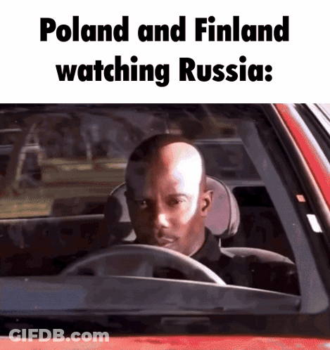 Bald Man Driving Red Car Watching Russia Poland Finland GIF