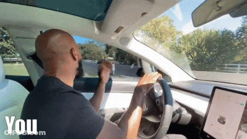 Bald Man Driving Tesla Model 3 GIF