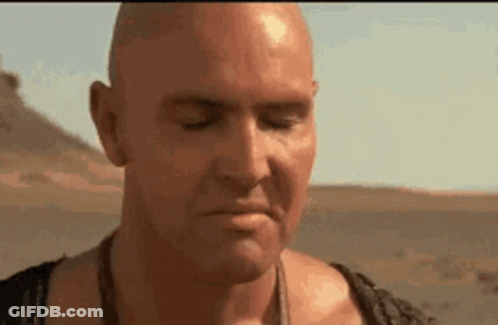 Bald Man Eyes Closed Mouth Open Desert GIF