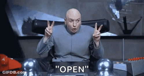 Bald Man Giving Peace Sign Saying Open GIF