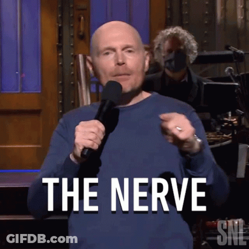 Bald Man Holding Microphone Saying The Nerve GIF