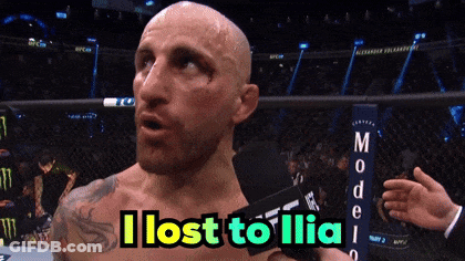 Bald Man Holding Microphone Says I Lost To Ilia GIF