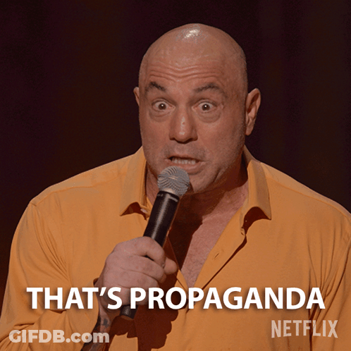Bald Man Holding Microphone Says That's Propaganda GIF
