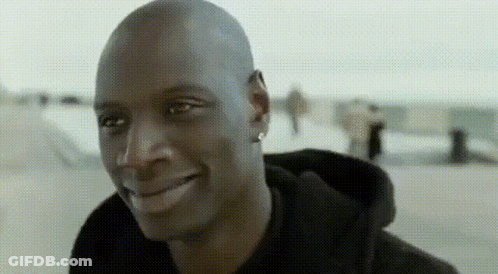 Bald Man In Black Hoodie Smiling GIF