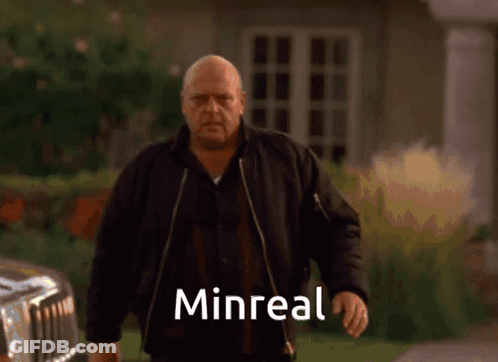 Bald Man In Black Jacket With Minreal GIF