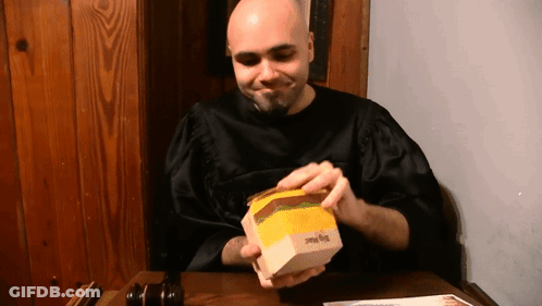 Bald Man In Black Robe Opening Big Mac GIF