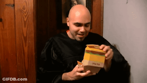 Bald Man In Black Robe Opening Big Mac GIF