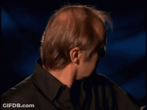 Bald Man In Black Shirt Making Funny Face GIF