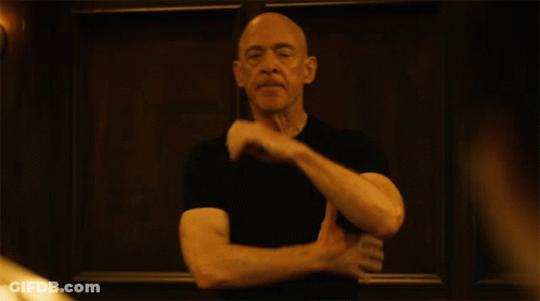Bald Man In Black Shirt Making Funny Face GIF
