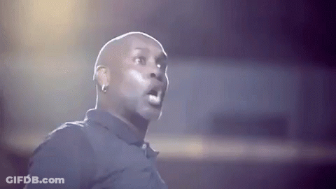 Bald Man In Black Shirt Making Funny Face GIF
