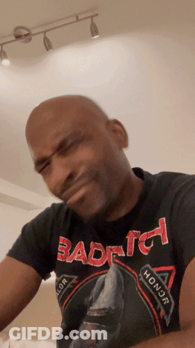Bald Man In Black Shirt Saying Bad To Honor With Funny Face GIF