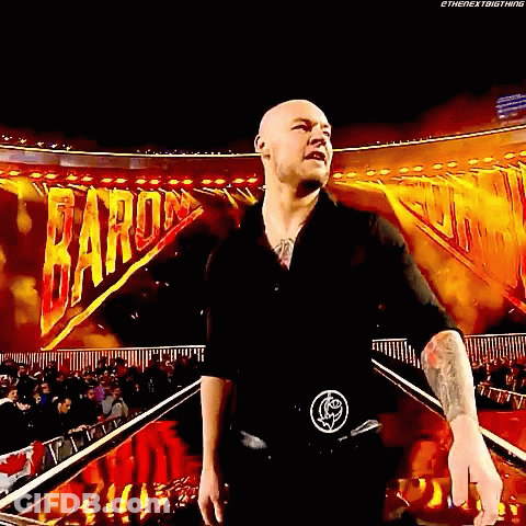 Bald Man In Black Shirt With Crowd And Baron Sign GIF