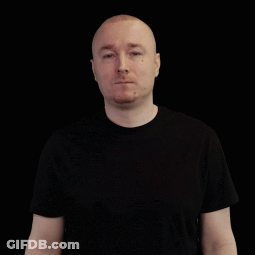 Bald Man In Black T-Shirt Looking Sideways GIF