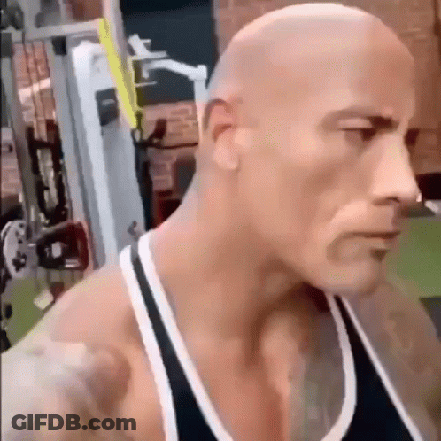 Bald Man In Black Tank Top In Gym GIF