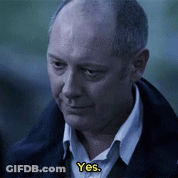 Bald Man In Blue Jacket Talking To Another Man GIF